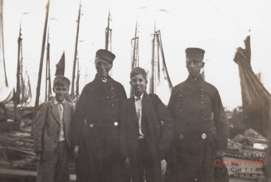 Constant, Jan and two other men in traditional Dutch costumes. Constant, Jan and two other men in traditional Dutch costumes.