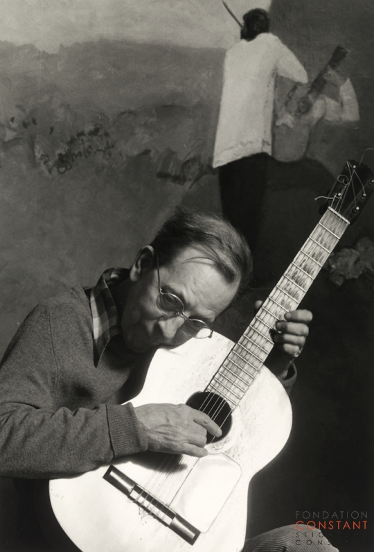 Constant-Playing guitar in front of Nostalgia, 1982 Constant Nieuwenhuys-Playing guitar in front of Nostalgia, 1982