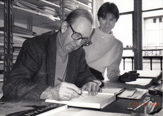 Constant signs his book Les trois espace, 1992 Constant signs his book Les trois espace, 1992
