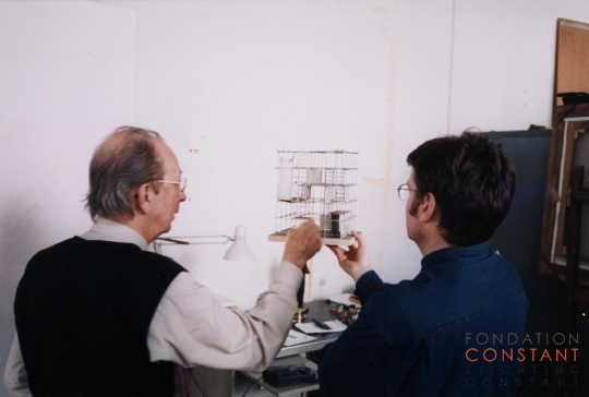 Constant-Constant and Mark Wigley looking at the model ESR, 1998 Constant Nieuwenhuys-Constant and Mark Wigley looking at the model ESR, 1998