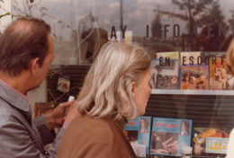 Constant and Adèle look at a window display